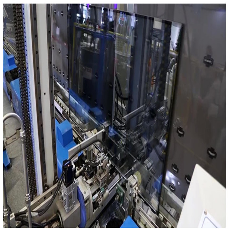 Robot de scellement de mastic pour vitrages de forme IGU
